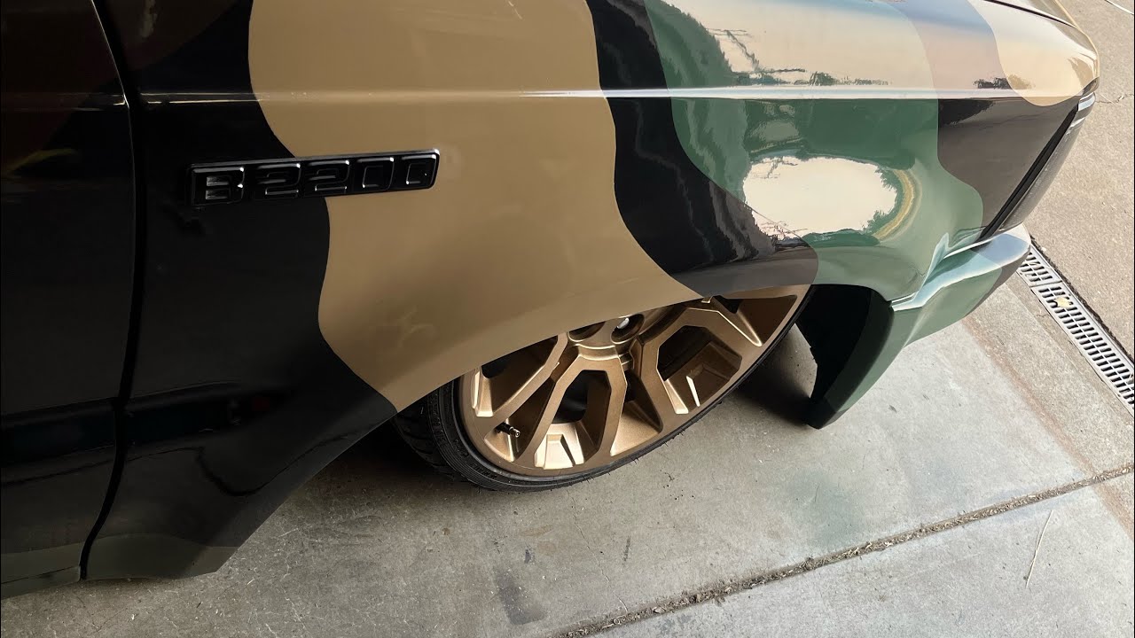 Bodydropped Mazda B2200 minitruck bagged, camo paint, safari window full custom interior