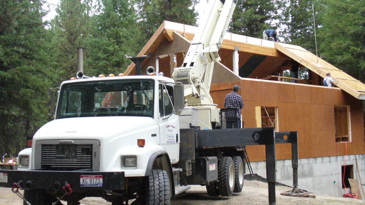 SIP roof installation on a mountain cabin.
