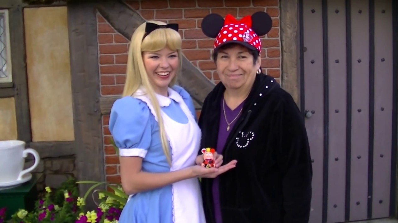 Alice Greets Guests in Epcot at Walt Disney World
