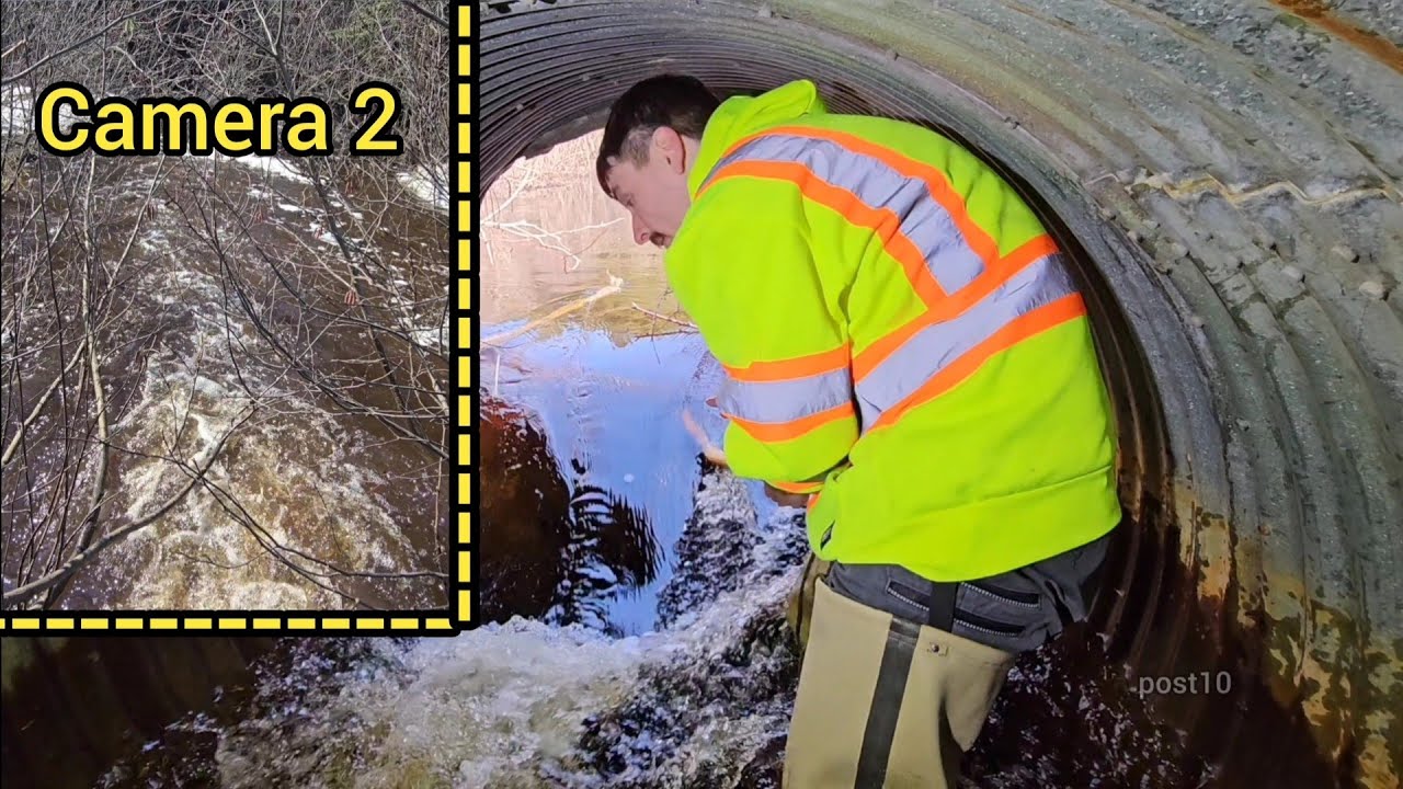 Unclogging A Really Big Culvert Taking Water Away From Overwhelmed Pipe Down The Road