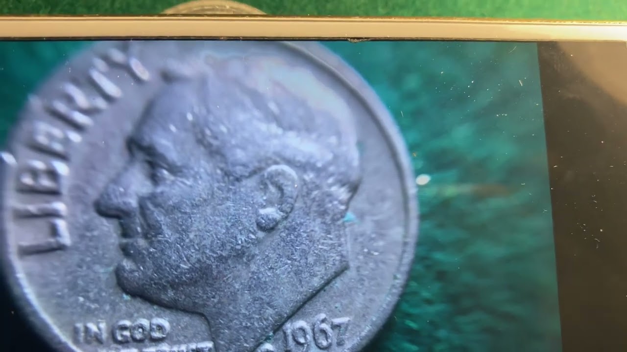 Possible error found on a 1967 dime coin United States currency in circulation. Magnified review 👁