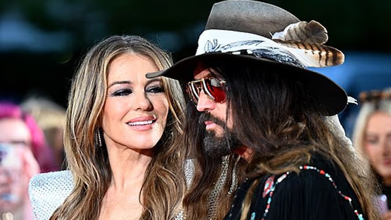 Elizabeth Hurley Hits the Red Carpet Alongside Billy Ray Cyrus and Son Damian in a Cleavage-Baring