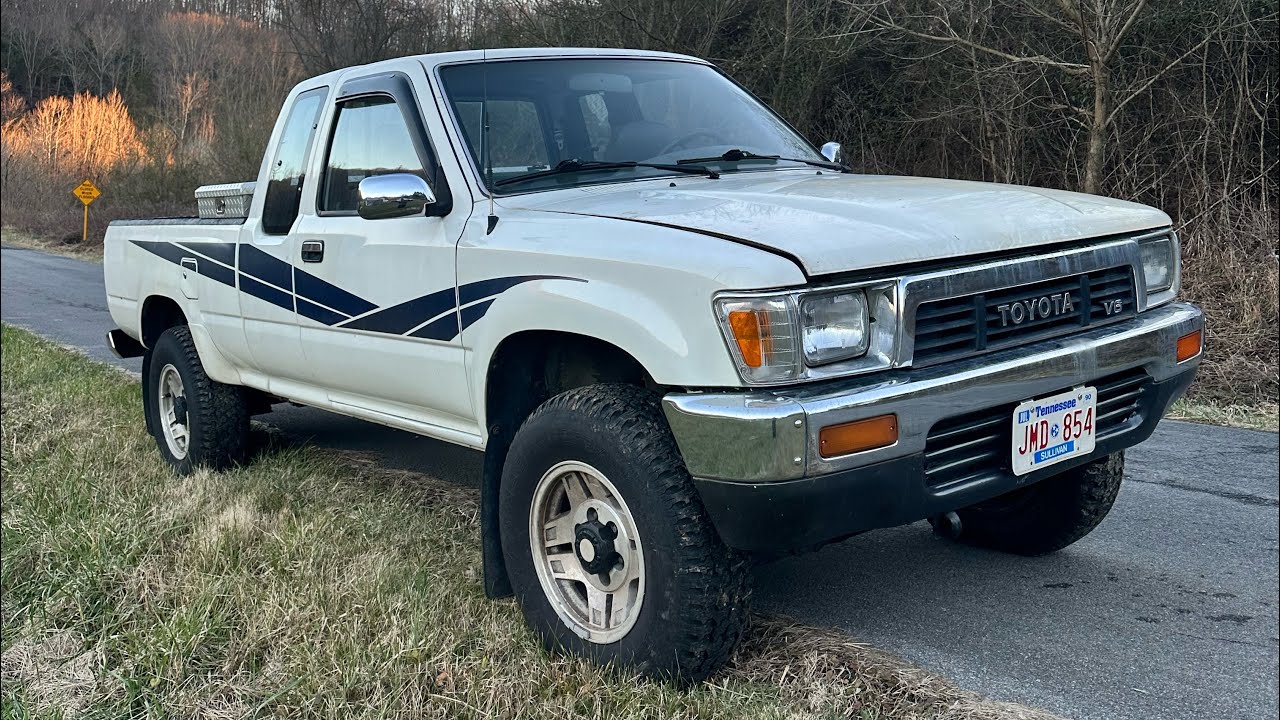 Think she likes the Toyota more than the Chevys!