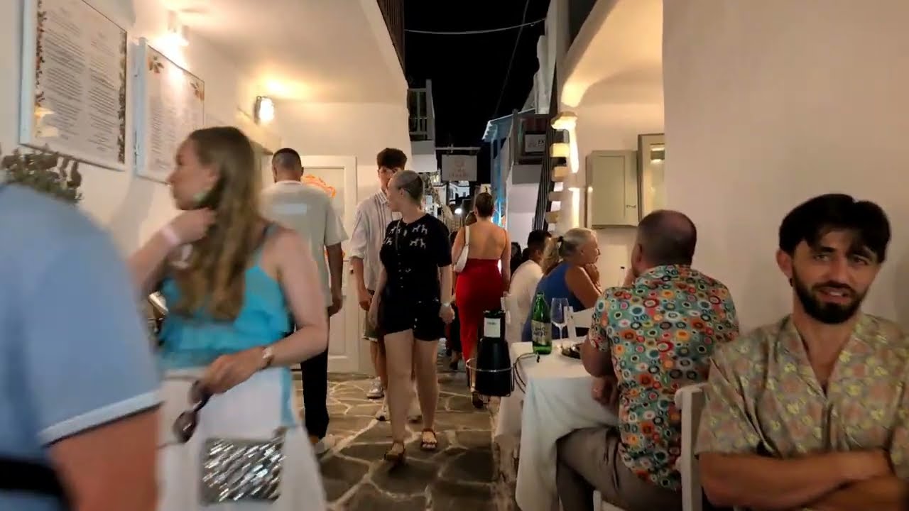 Walking the busy streets of Naoussa , Paros, Greece