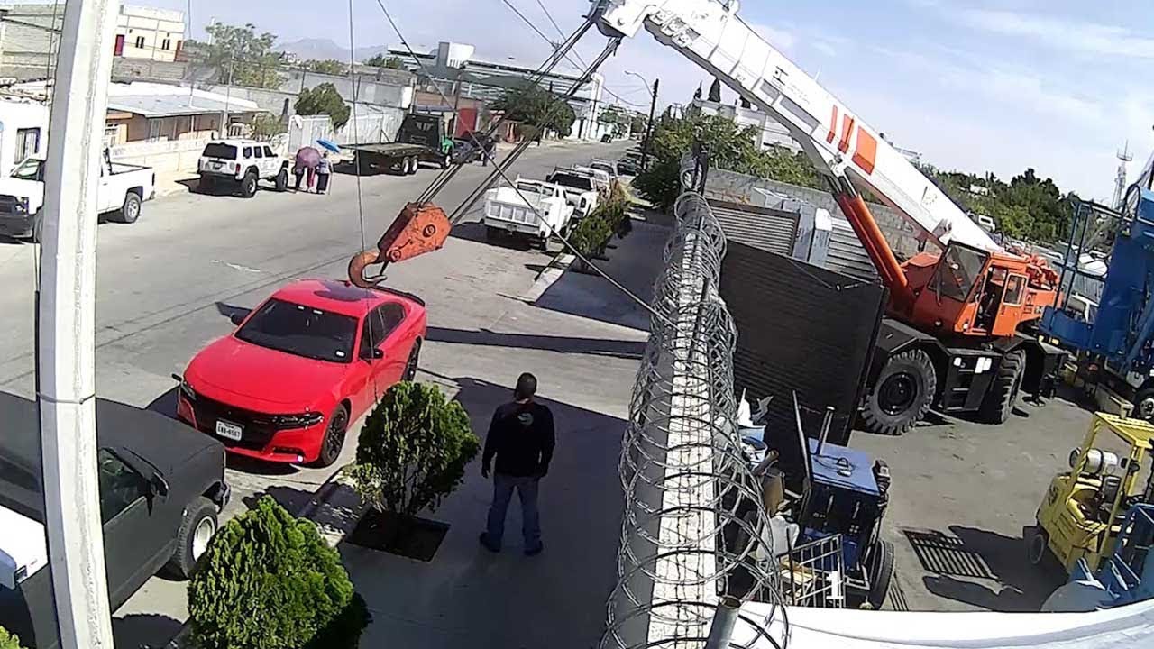 Hanging Crane Narrowly Misses Car Parked In Harbour