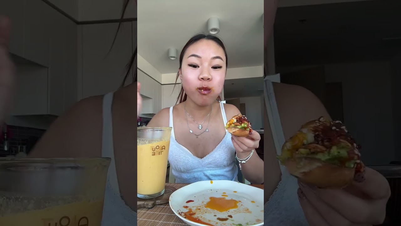 Avocado chili oil egg bagel n mango smoothie