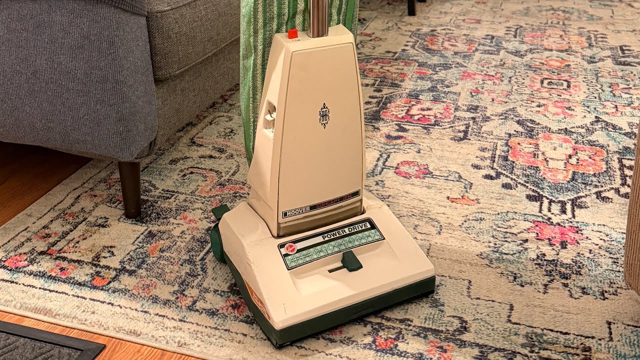Vacuuming with a Green Hoover Concept One