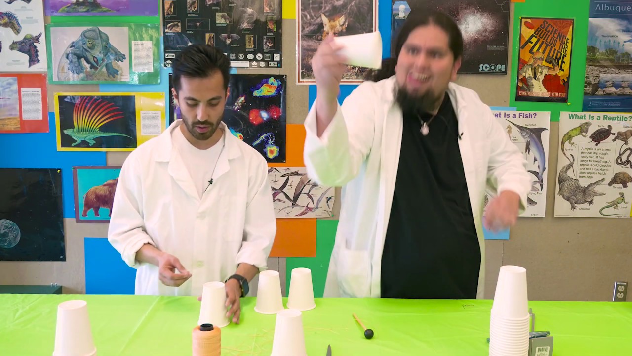 Making a string cup phone with the Santa Fe Children's Museum!