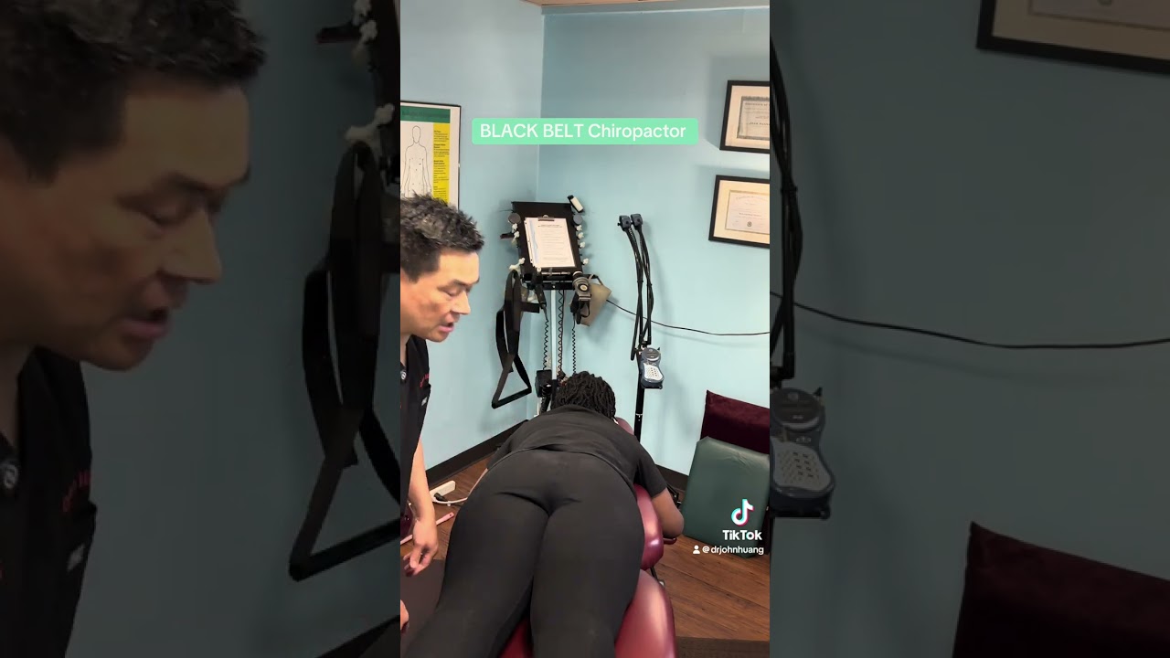 BLACK BELT Chiropactor giving an adjustment. Houston Chiropractor. Houston Asian Dinger.