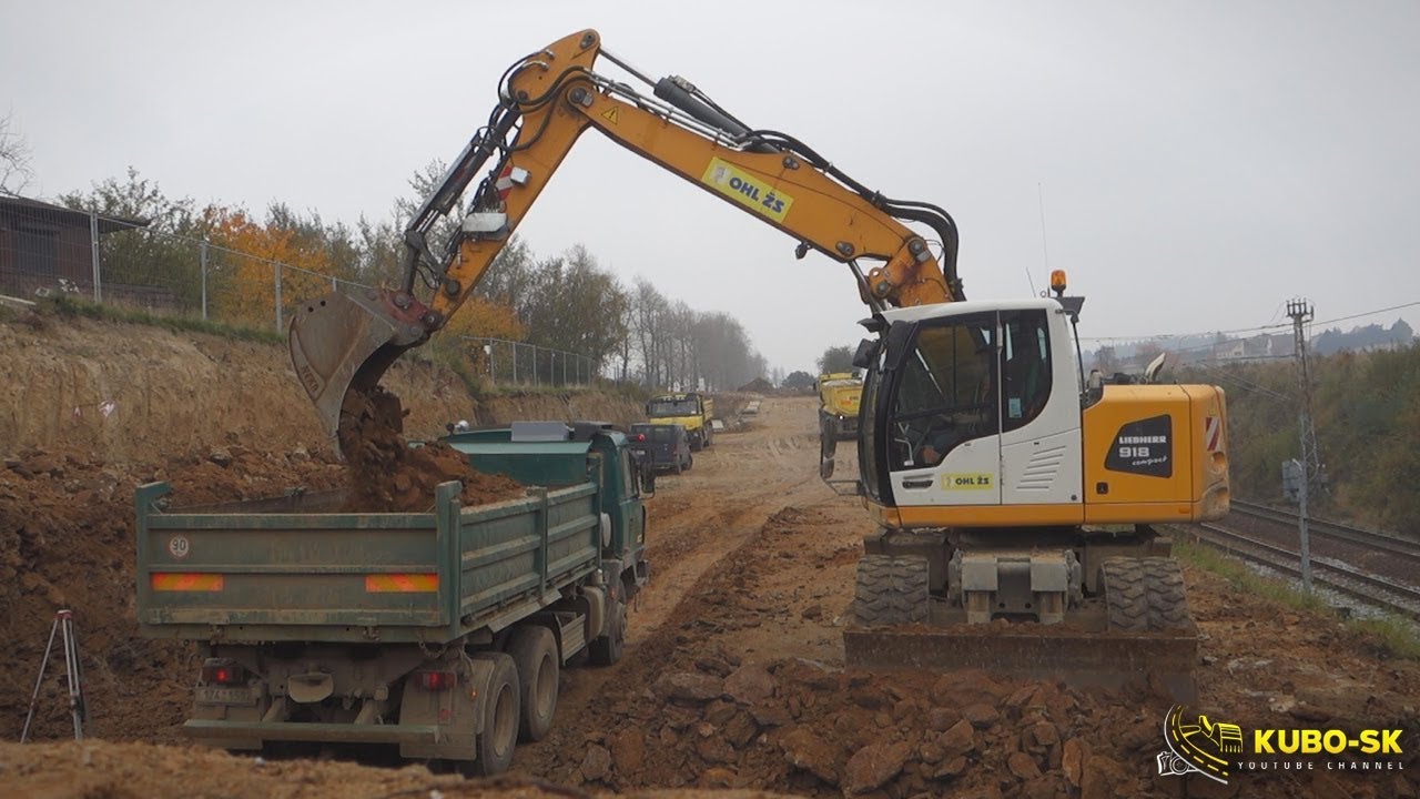 Liebherr A918 excavator digging rock and loading Tatra truck