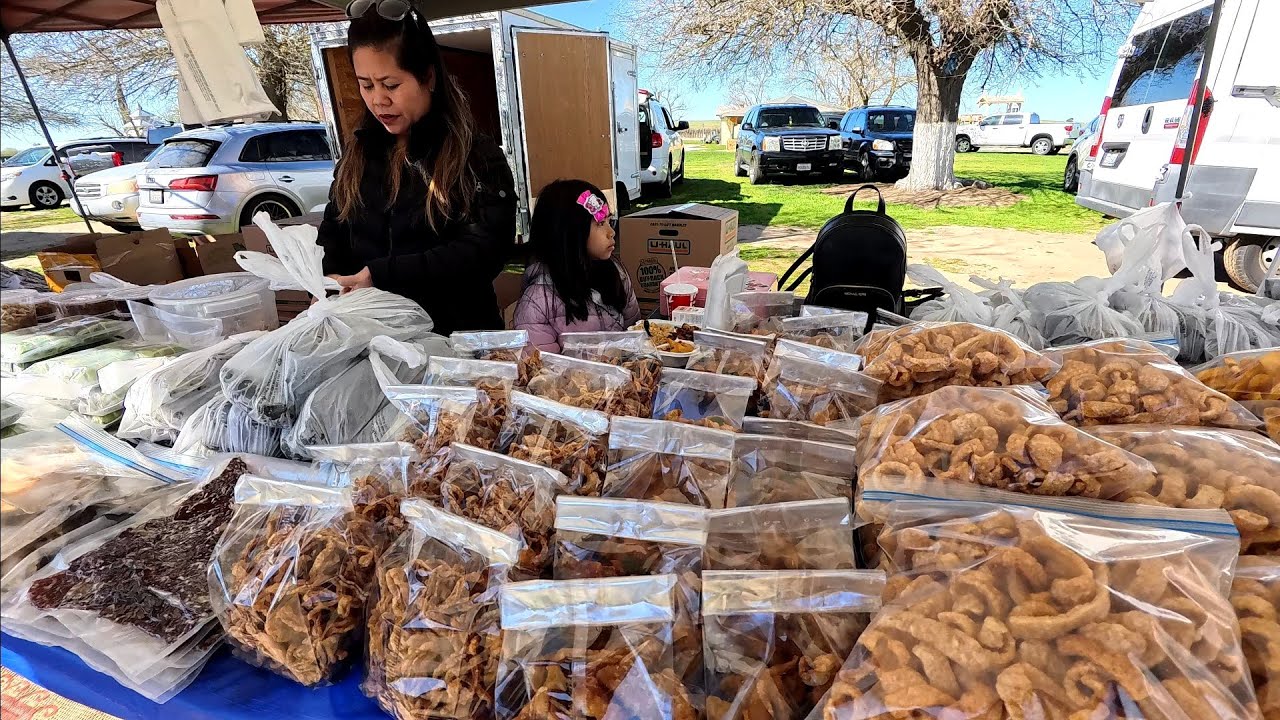 Selling Lao products and food at the temple. Celebrating special event in Fresno, California