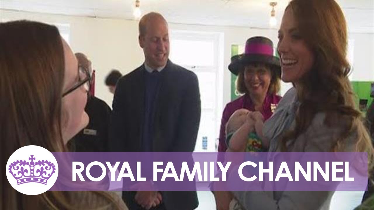 Kate Cuddles Baby During Charity Visit