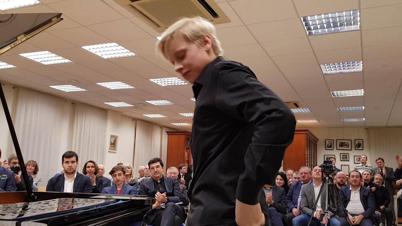 Alexander Malofeev performs in front of great chess players