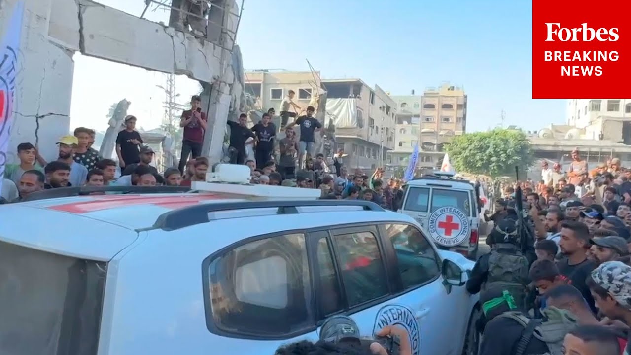 RAW VIDEO: Red Cross Vehicles Take Israeli Hostages From Gaza After Years In Hamas Captivity