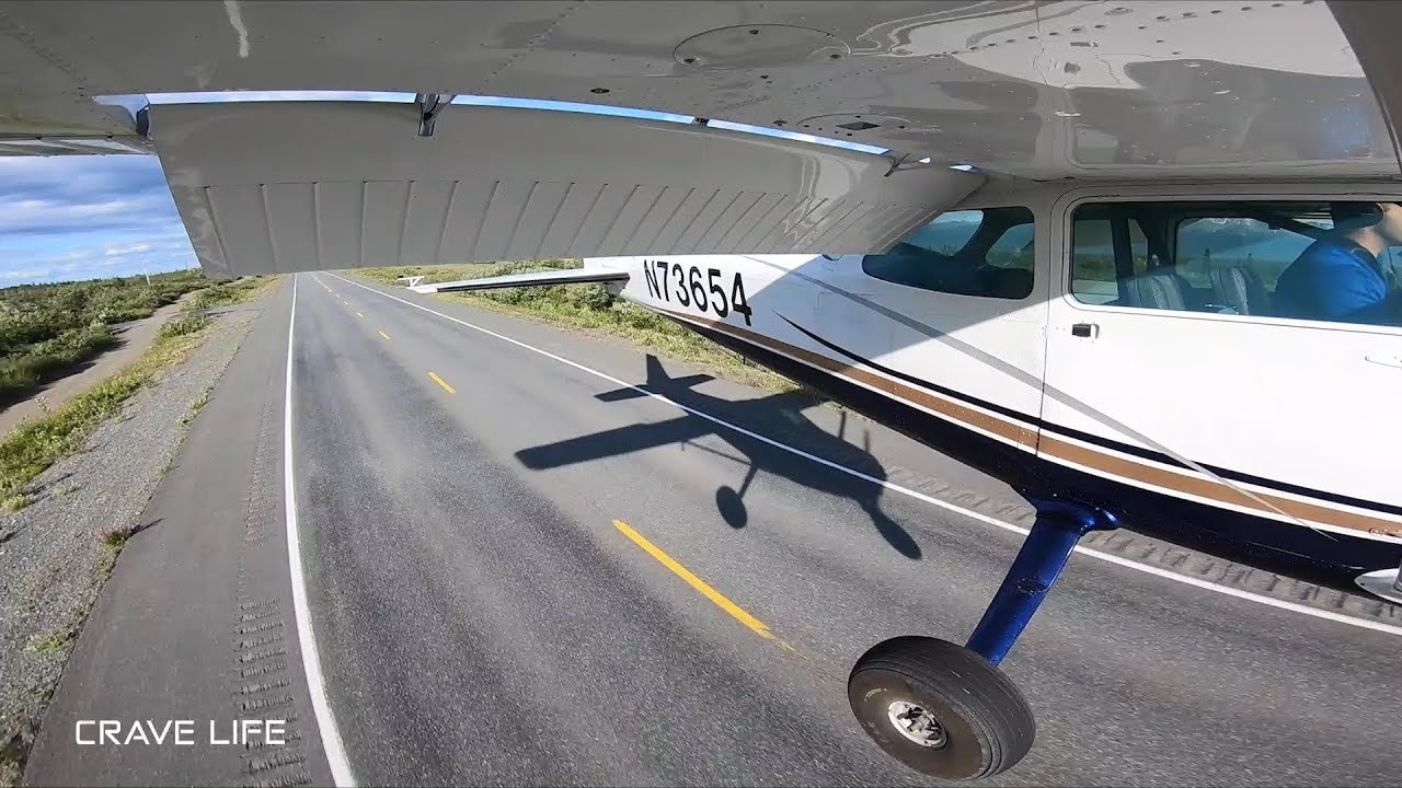 Aircraft Landing on the Alaska Highway - Sharing pavement with traffic