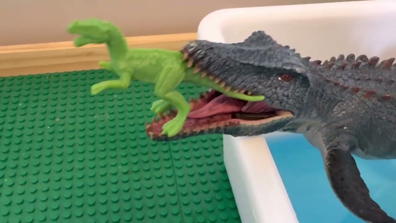 Baby Dino attacked by Mosasaurus