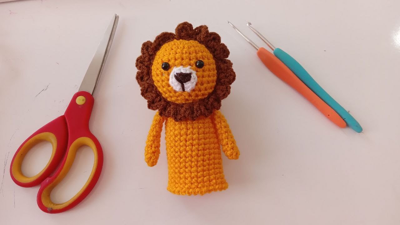 Learning how to crochet a lion finger puppet