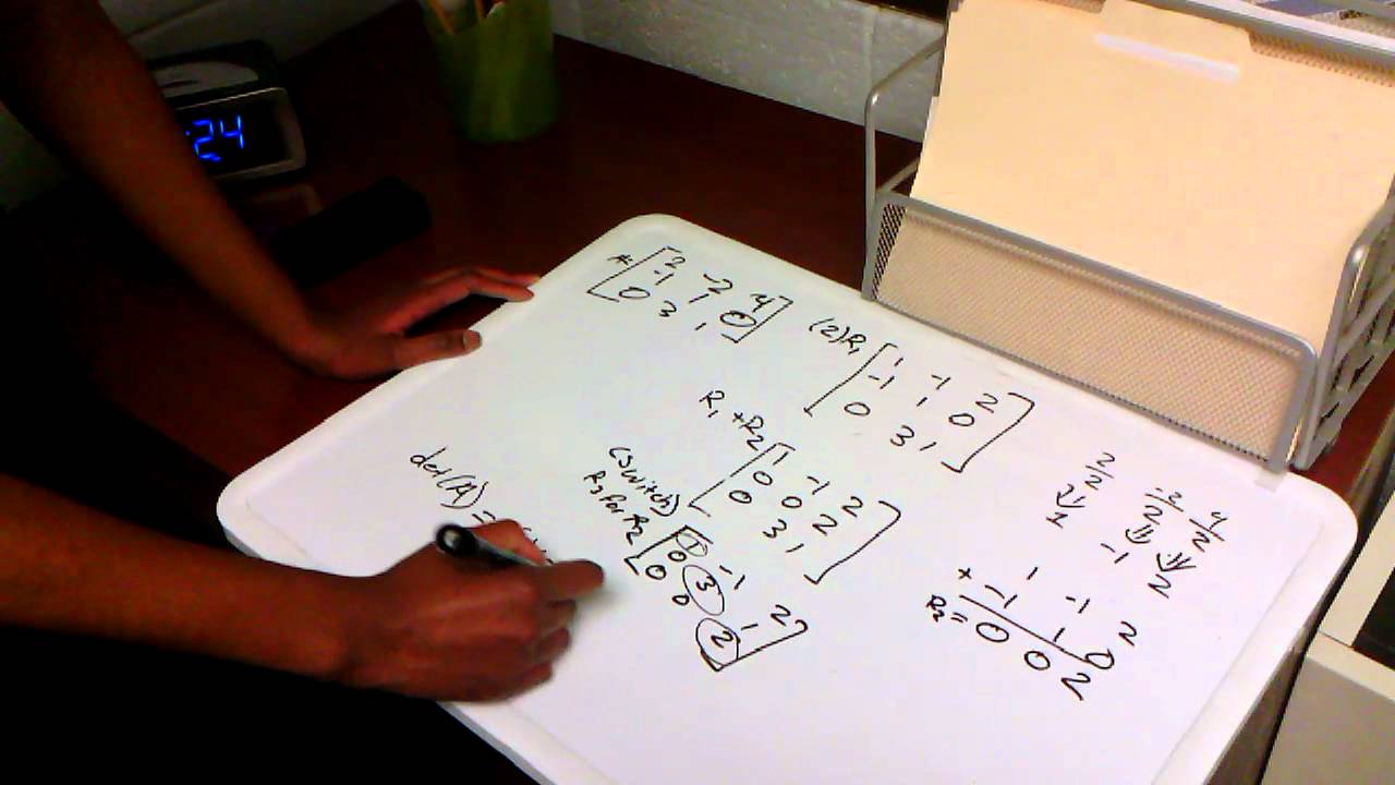 Solving for the determinant using row reduction