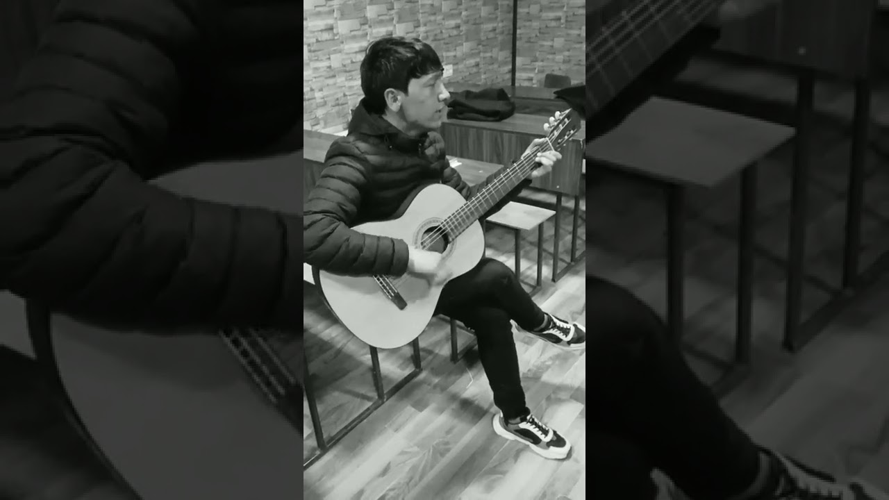 Azam jonli gitara bilan ijro