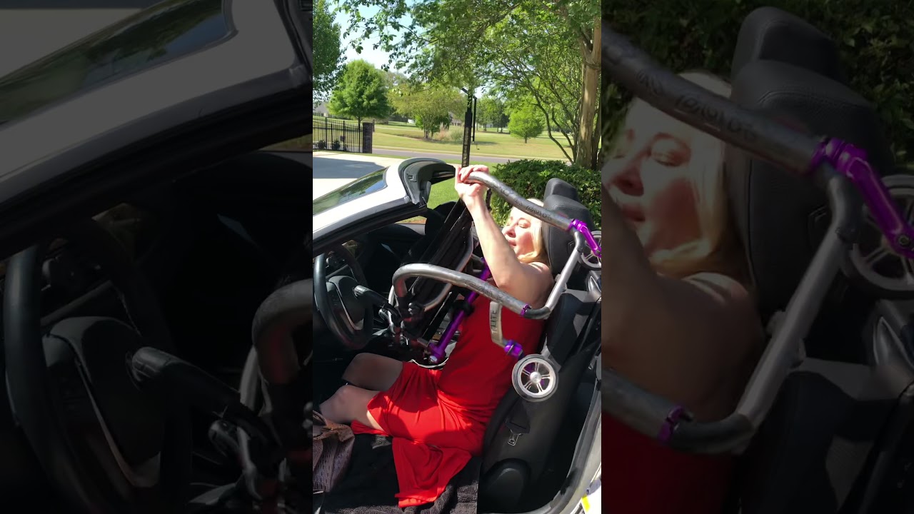 Wheelchair user getting out of a lower car.