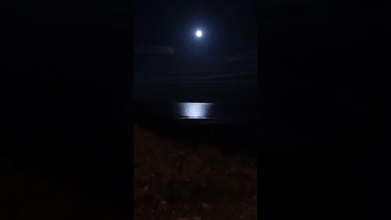 Moon reflection on the sea and rocks at Fraserburgh October 2025