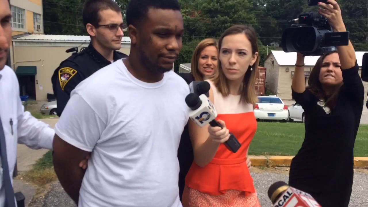 Mobile man accused of shooting two victims inside a vehicle remains silent on the way to jail