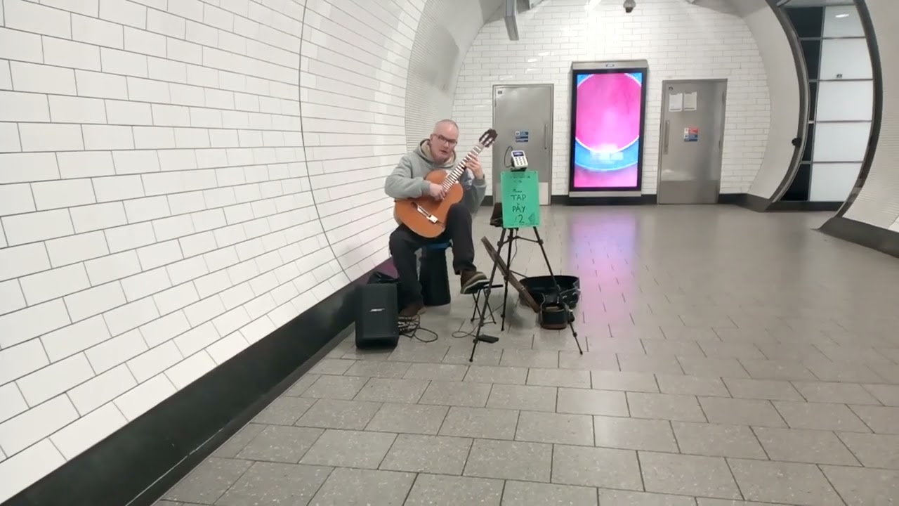 Guitarist at the Tottenham Court Road Station London