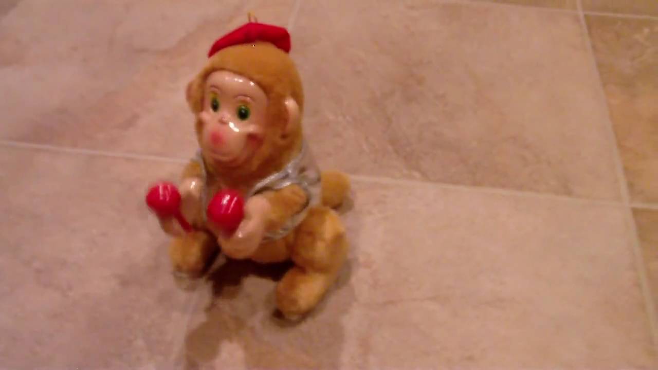 SOMERSAULTING MONKEY WITH MARACAS