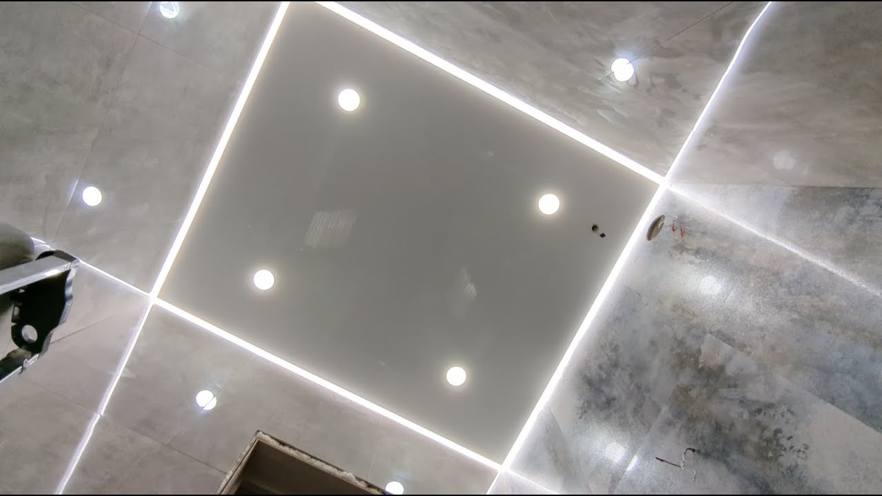 installation of a glossy stretch ceiling with a floating ceiling effect & LED lighting the perimeter