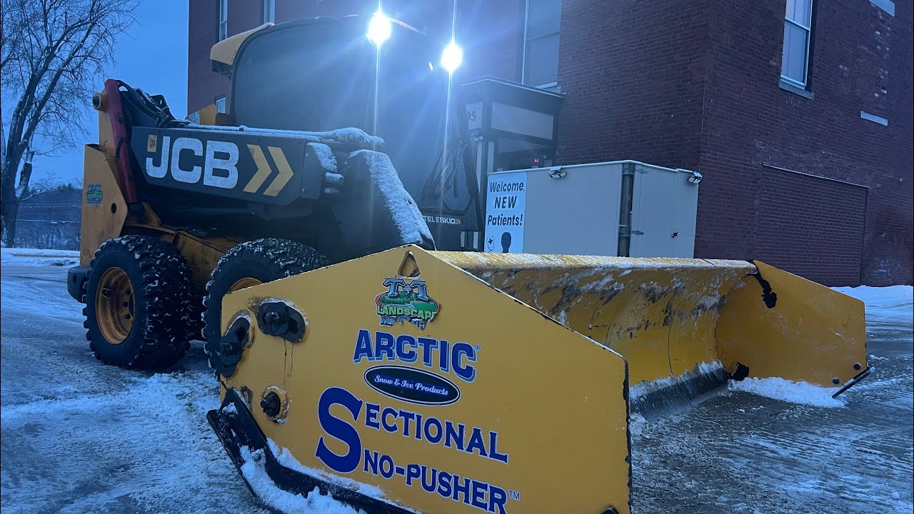 Commercial snow plowing in a skid steer