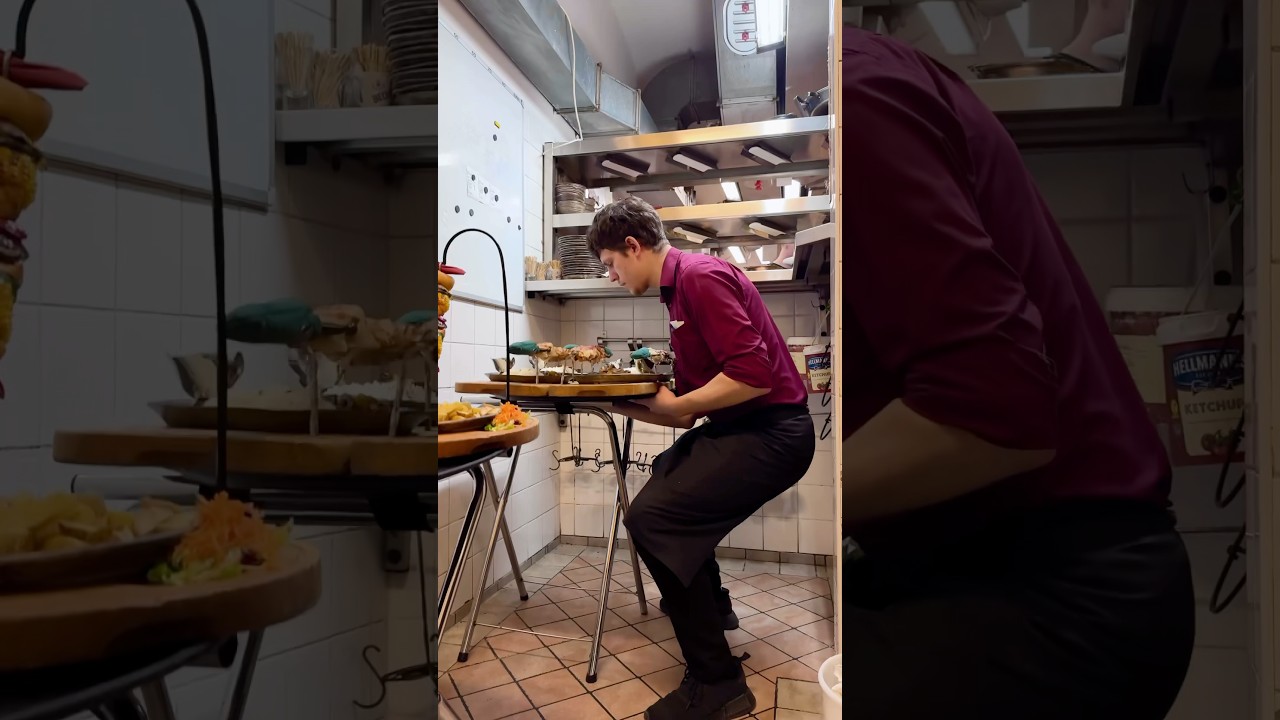 Food runner Ivan carrying two full trays with absolute precision. A true master at work!