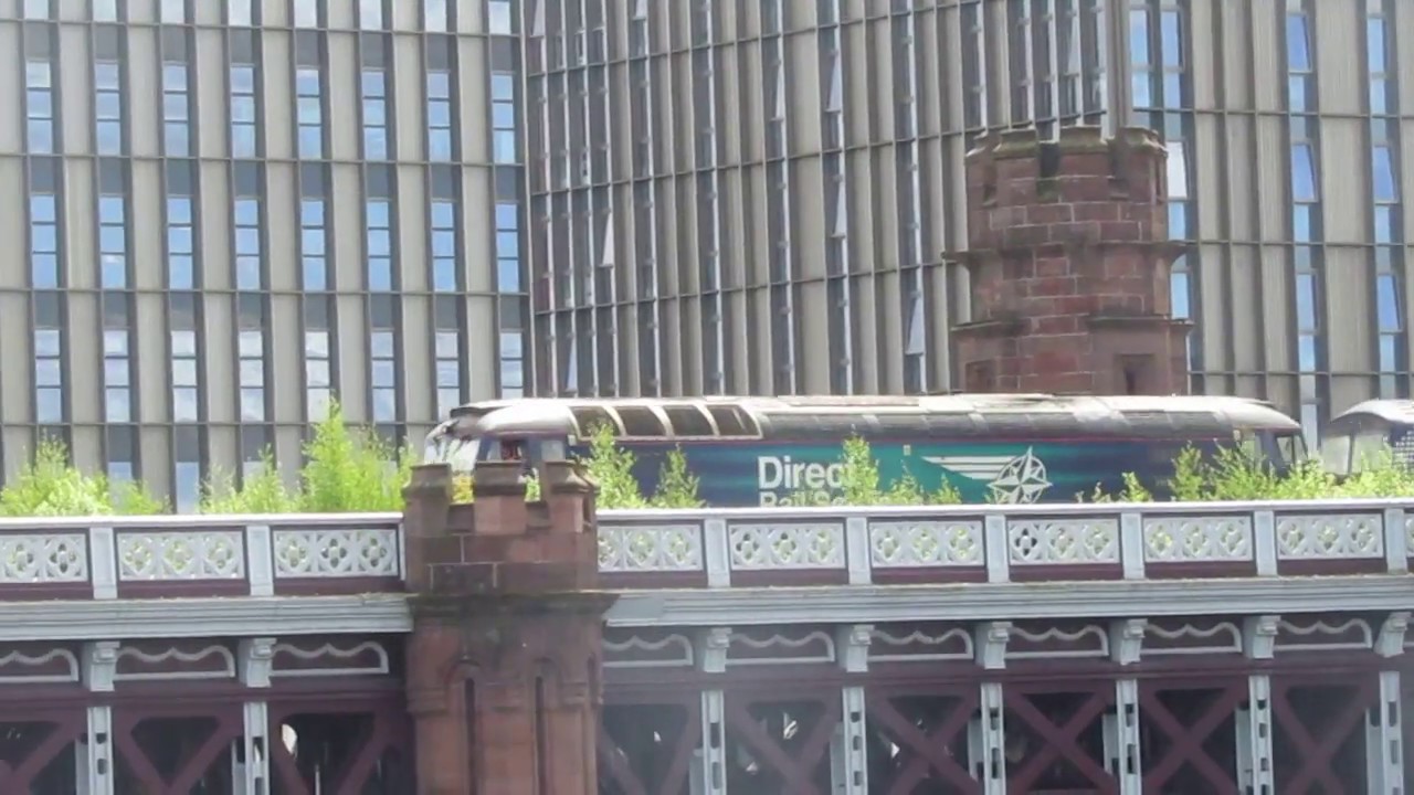 DRS 57303 'Pride of Carlisle' drags 320304 on the 538D Shields T.M.D. (E) to Glasgow Works