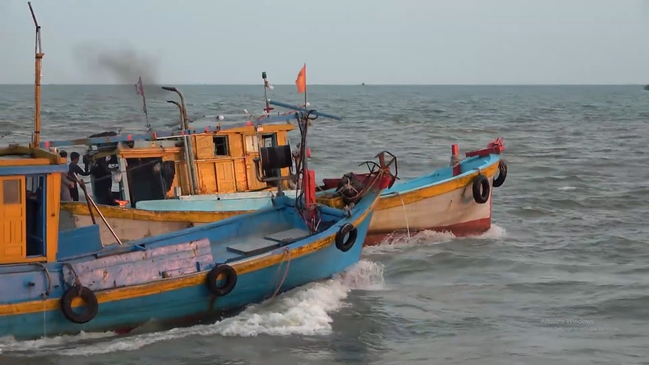 Asian seaports, small but numerous boats.