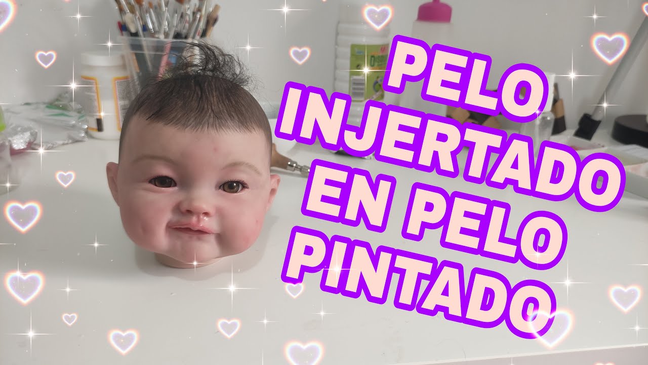 Injertando en pelo pintado a un Bebé reborn.