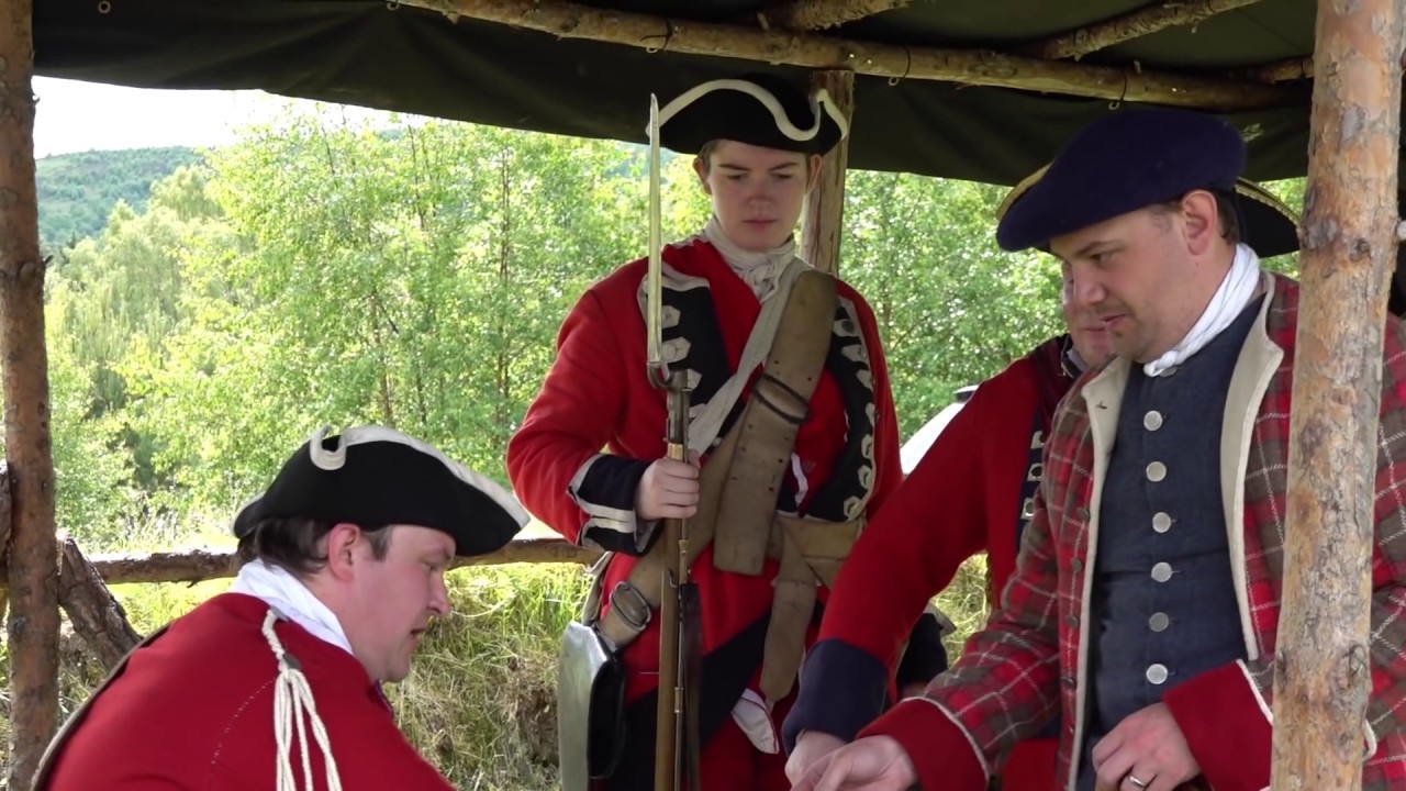 Highland Rising 2019 - Redcoats arrive in Jacobite township Baile Gean Scotland to demand taxes