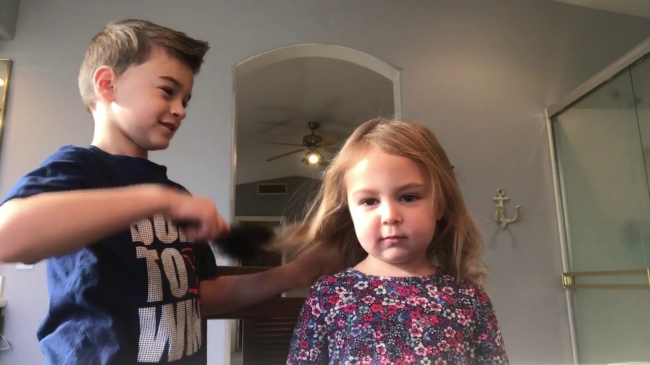 Big Brother tries to do little sisters hair and nails it