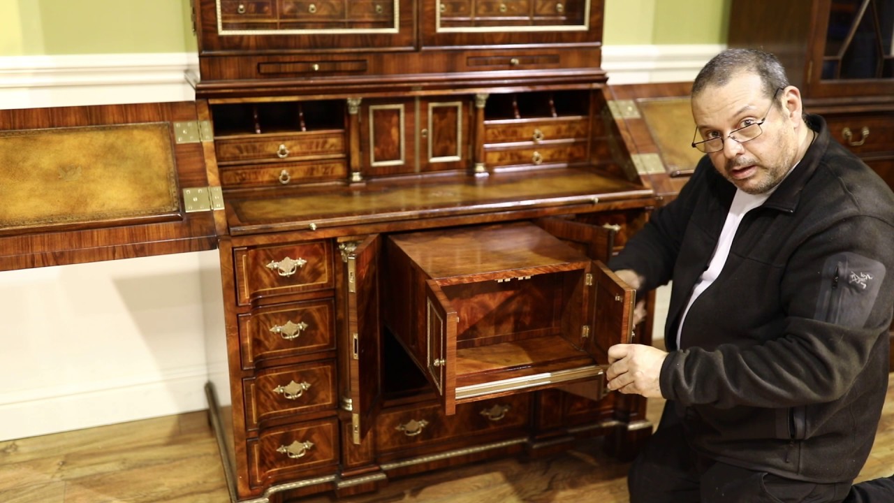 Secretary desk with secret compartments. Brass and leather top slant-lid desk