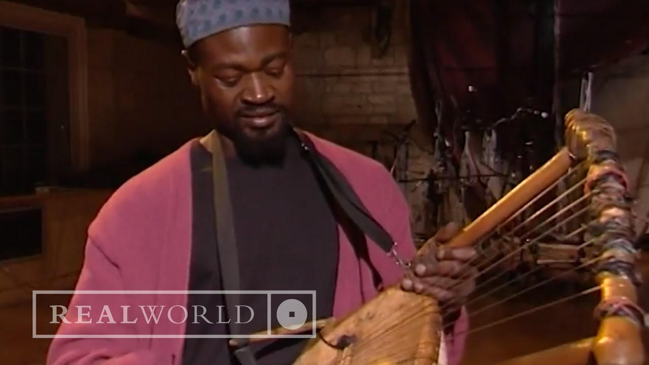 Ayub Ogada demonstrates a Nyatiti (African instrument)