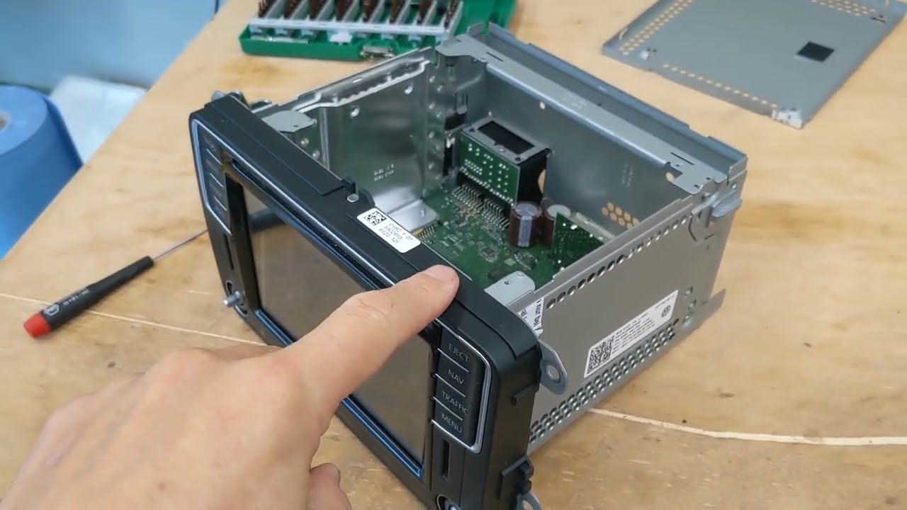 Repairing the faulty touch sensor on a VW head unit.