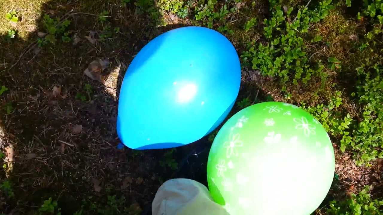 Popping some balloons outside