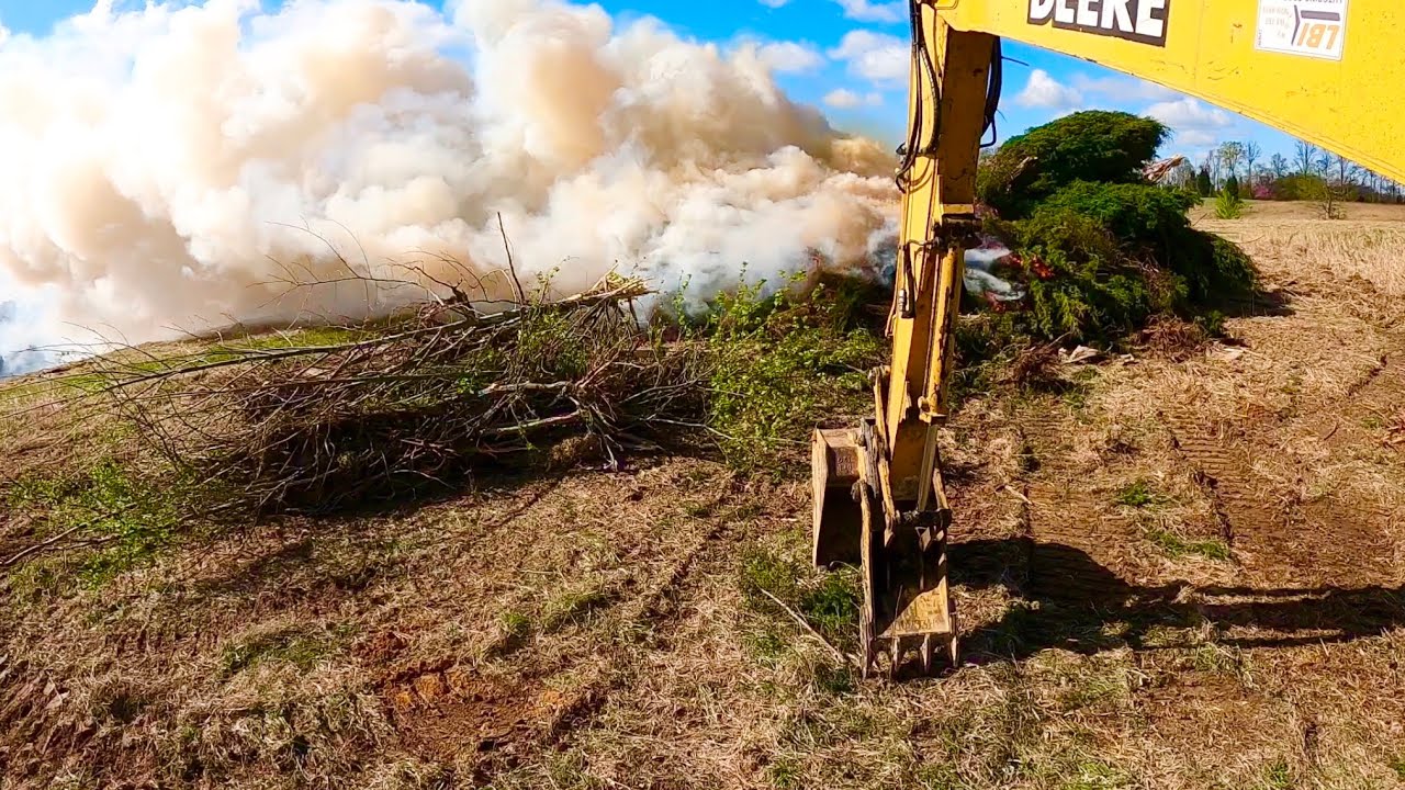 Clearing and Burning Cedar Trees so Farmer Chris can reclaim Field