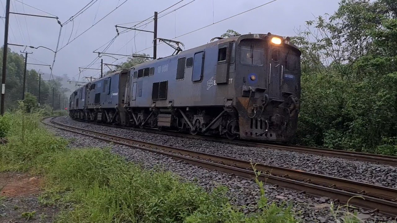 Spoornet followed by Transnet class 18E locomotives, two trains same direction heading for Durban.