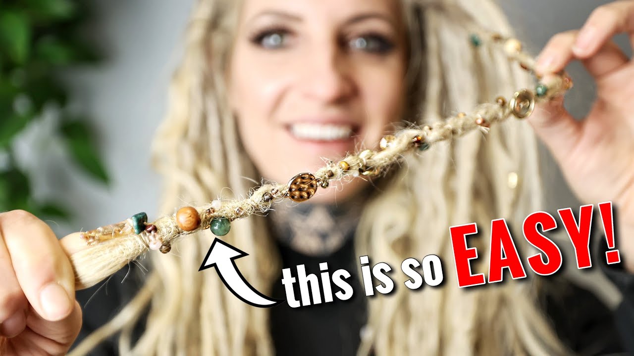 sewing beads onto my dreadlocks