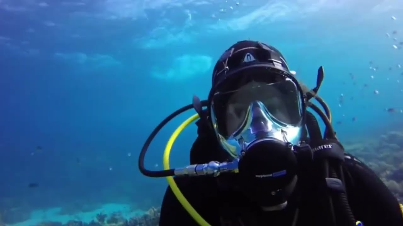 Female Diver is Diving with Neoprene Wetsuit and Ocean Reef Full Face Mask