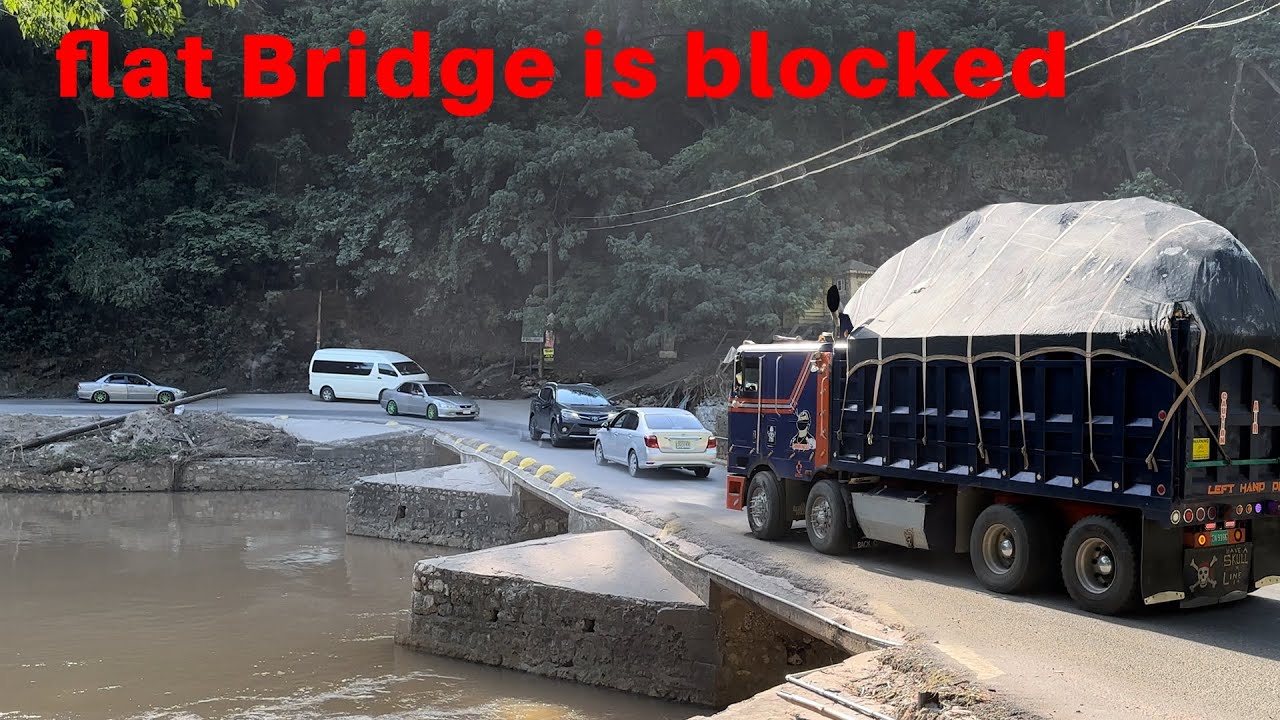 The flat bridge is blocked! What would you do in this situation? Would you reverse?