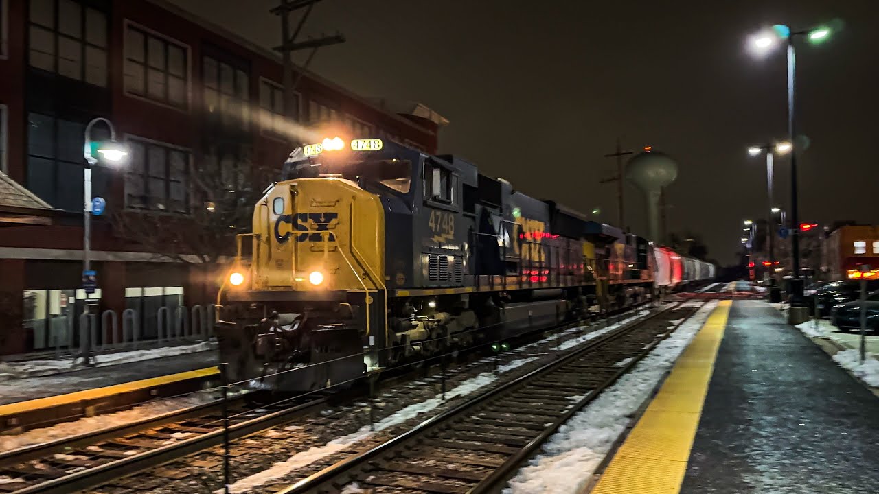 CSXT 4748 (SD70MACe) leads CPKC 646 east through Northbrook