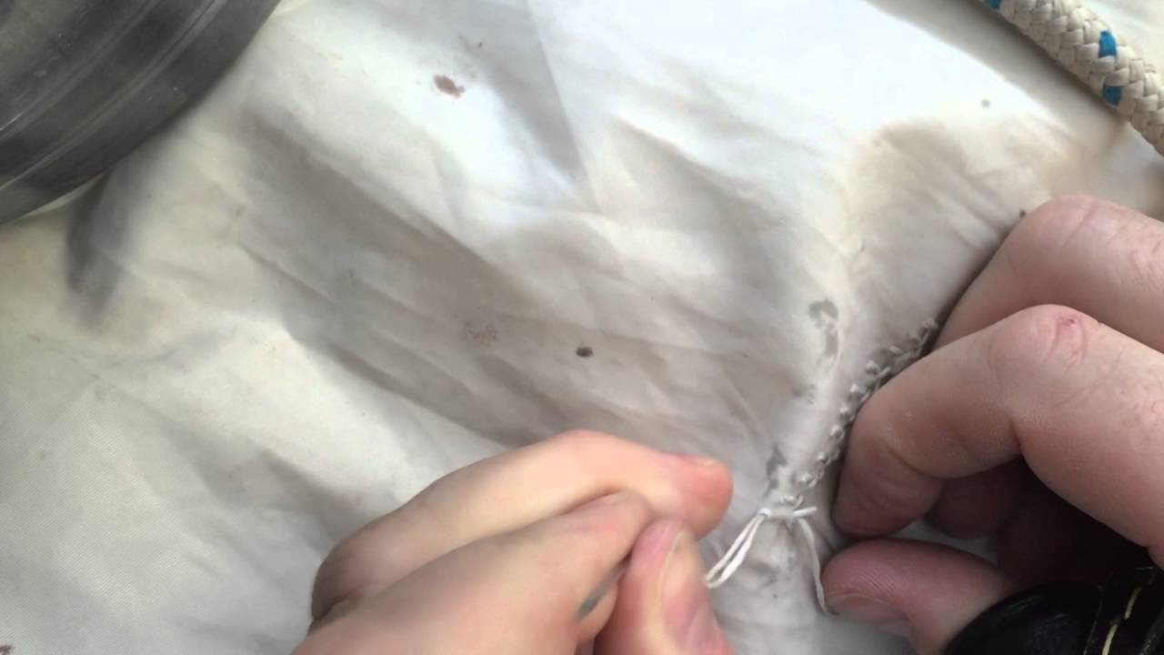 Hand Sewing a small tear in a Sail.