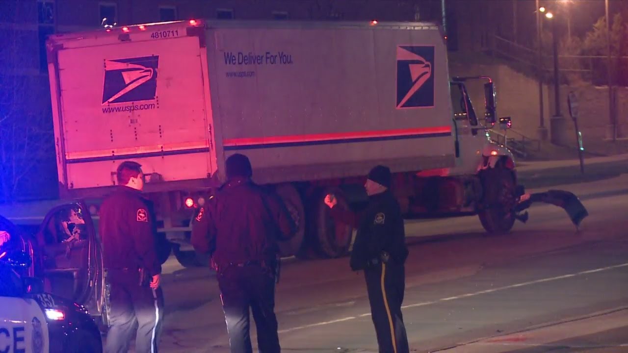 Car runs red light, hits mail truck, driver suspected of DUI