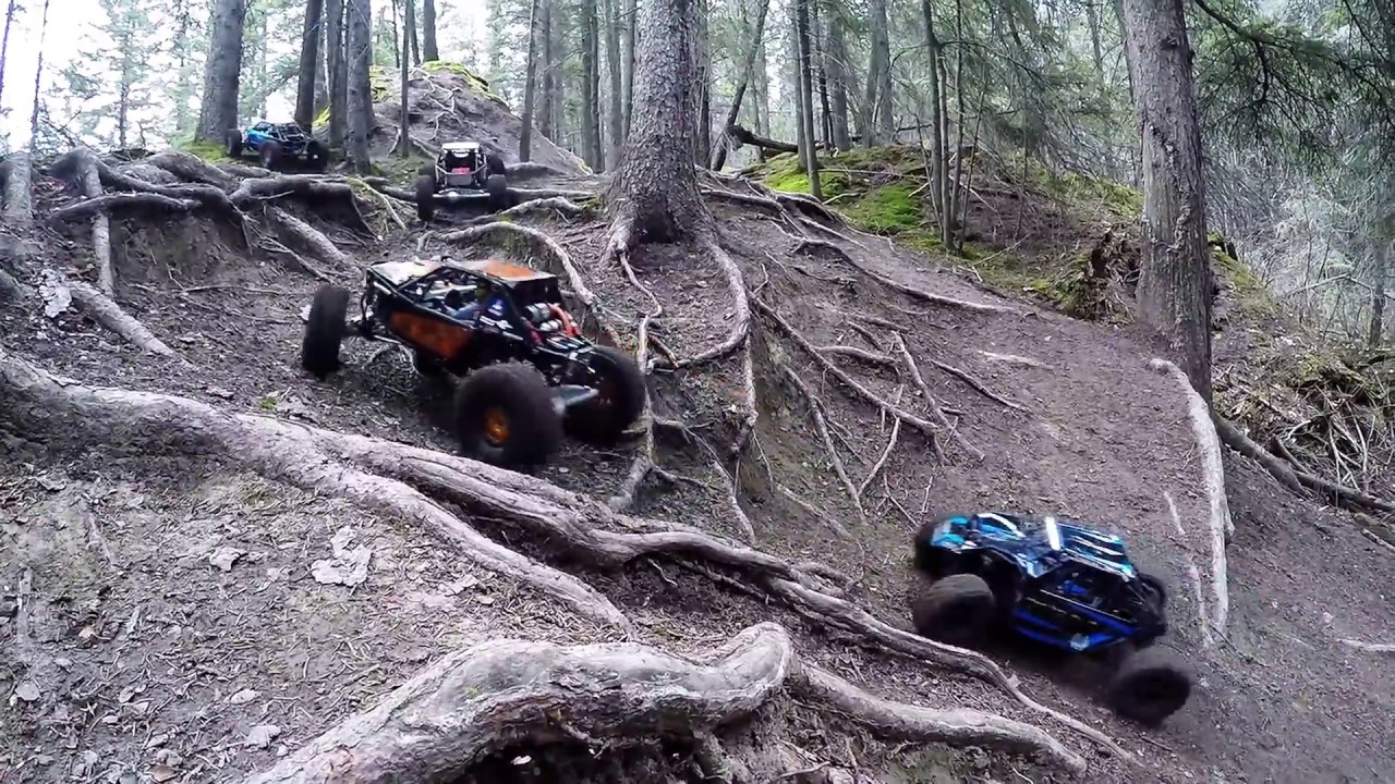Losi Rock Rey Axial Yeti and Bombers huge air and bash in the forest