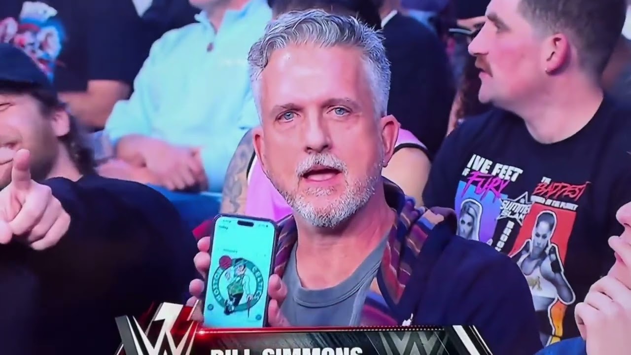 Bill Simmons flashes the Boston Celtics logo on his iPhone at the WWE Netflix premiere @ Los Angeles